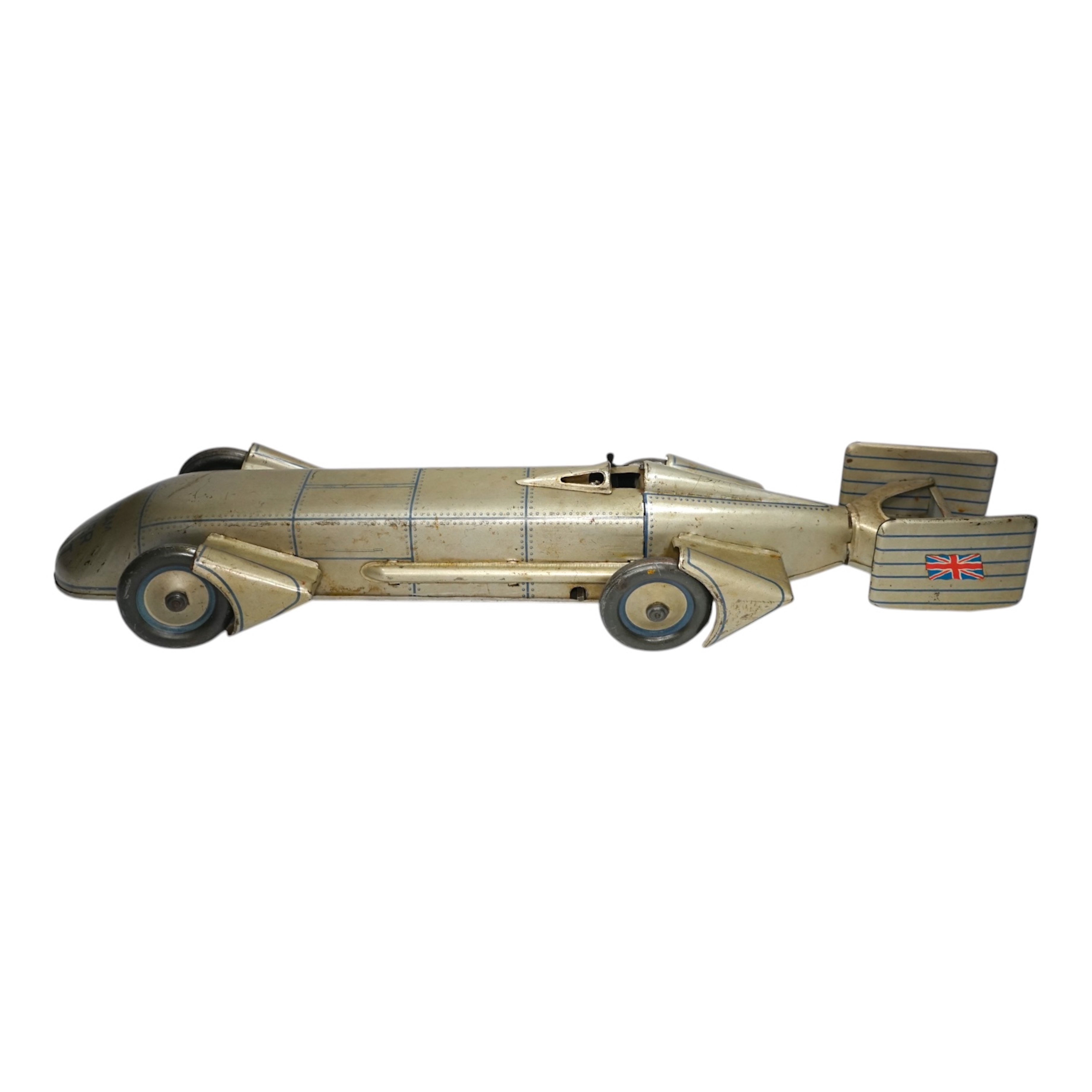 A 1930s Gunthermann (Germany) clockwork tinplate Sunbeam Silver Bullet world record car, with blue printed panel and rivet detail, driver, and Union flags to tail fins, stamped with ‘Foreign’ to underside, 56cm long. Con